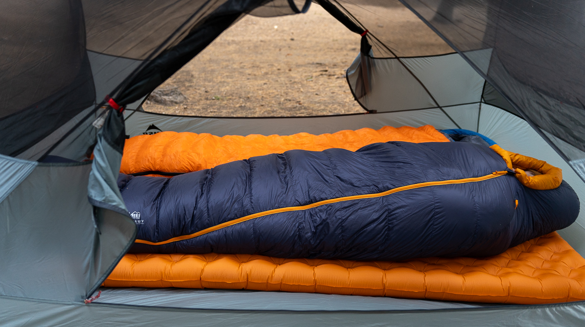 man sleeping in backpacking sleeping bag