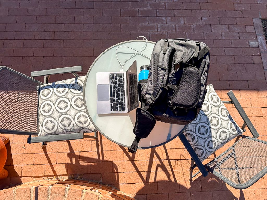 table with laptop and backpack