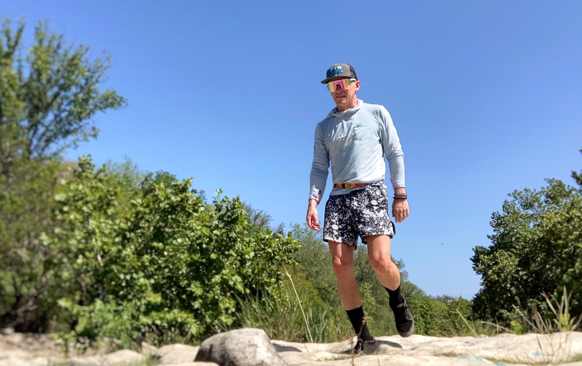 man hiking in sun shirt