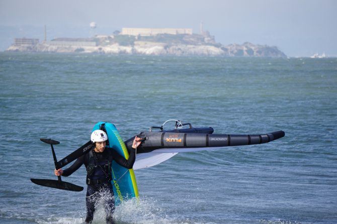 Will Sileo coming out of the water after wing foiling at Crissy Field